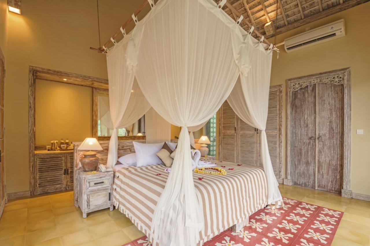 Wapa Di Ume Sidemen Ξενοδοχείο Εξωτερικό φωτογραφία A bed with a mosquito net